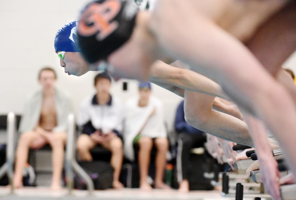 McDowell High School senior Christopher Zhou, top left, led from the start to win the 50-yard freestyle during the Cathedral Prep Invite at the Hallman Aquatic Center, Hagerty Family Events Center, in Erie on Saturday.