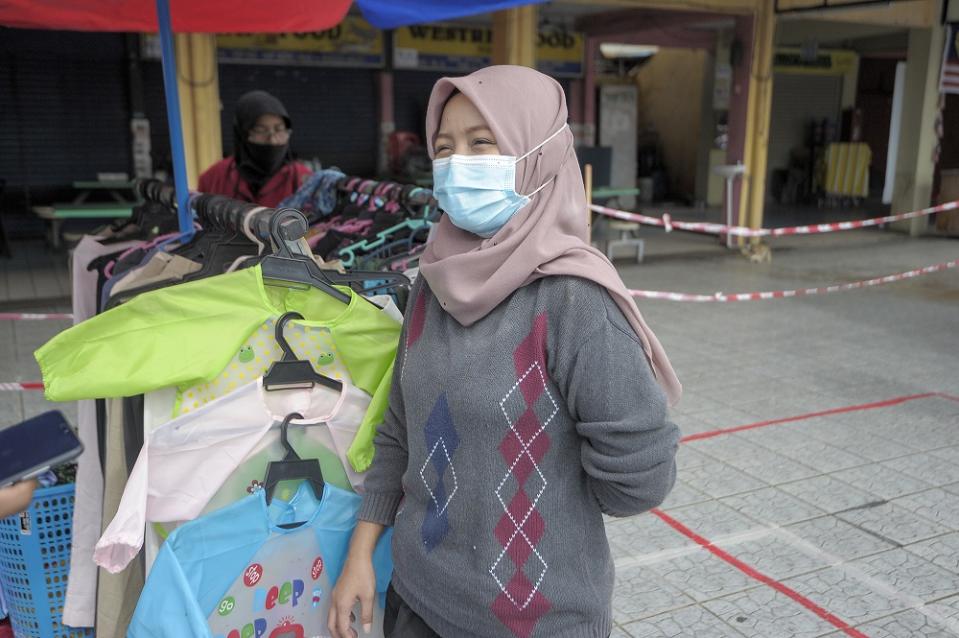 Noryatima Abdullah who has a stall at the Taman Melawati market said she has prepared a second source of income should there be a second lockdown. — Picture by Shafwan Zaidon