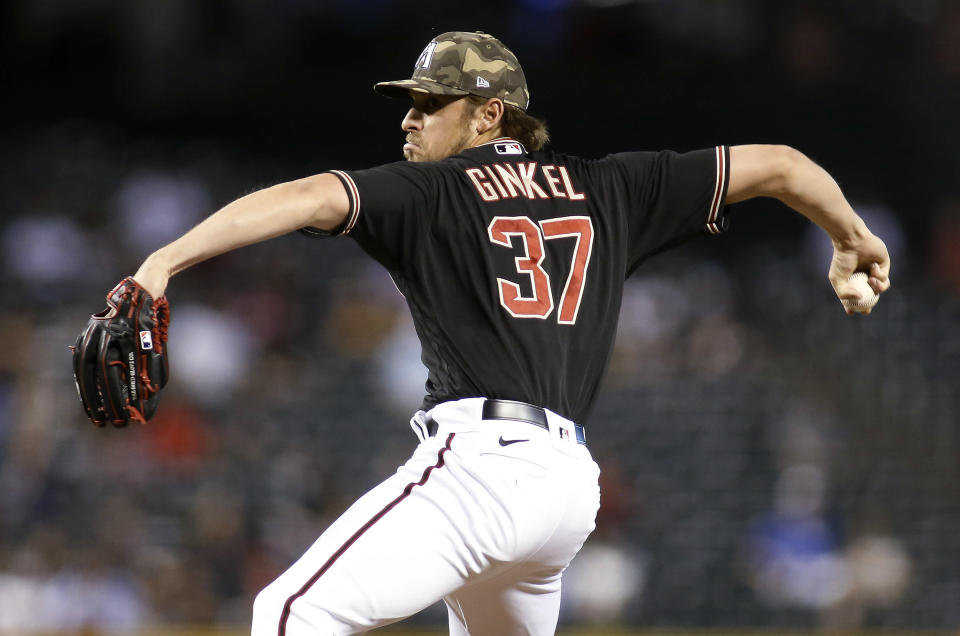 Arizona Diamondbacks' Kevin Ginkel delivers a pitch against the Washington Nationals during the sixth inning of a baseball game Friday, May 14, 2021, in Phoenix. (AP Photo/Darryl Webb)