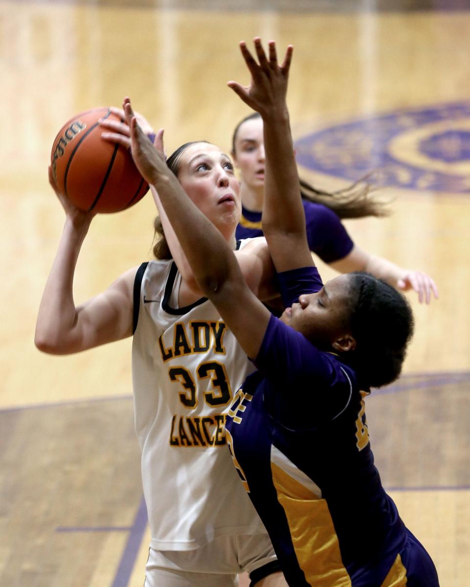St. John Vianney's Taylor Sofilkanich (#33) looks to the basket over St. Rose's Tanaiyah Decker (#23) during their game in Belmar Wednesday evening, January 31, 2024.