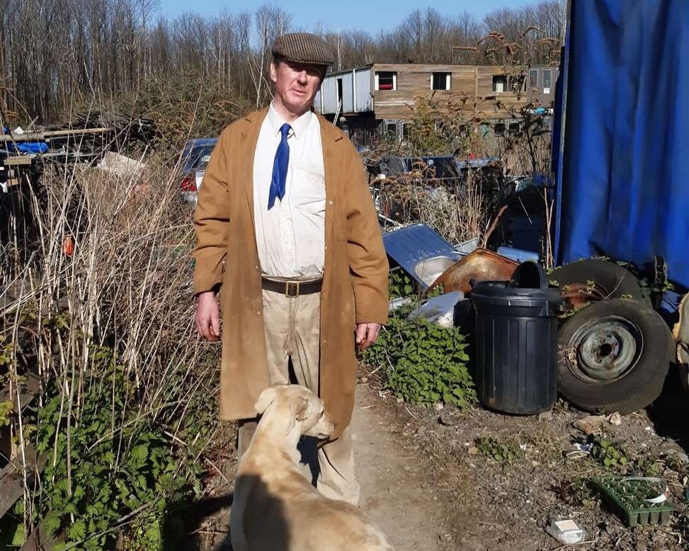 Langley Beck on his land where he has lived since the 1980s. (SWNS)