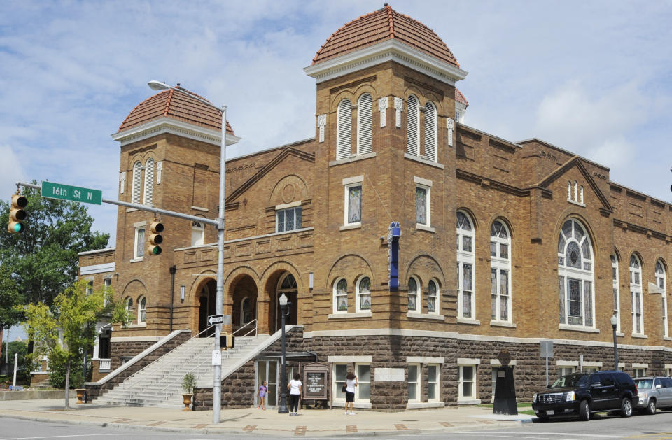 FILE - Visitors look at 16th Street Baptist Church, July 29, 2016, in Birmingham, Ala. Alabama on Friday, Sept. 15, 2023, will mark the 60th anniversary of the 1963 bombing at 16th Street Baptist Church that killed four girls. Lisa McNair, the sister of one of the victims, said as the anniversary is remembered, she hoped people will think about what they can do to combat hate. (AP Photo/Jay Reeves, File)