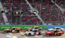 Daniel Hemric (18) leads Harrison Burton (20), Noah Gragson (9), Justin Allgaier (7) and Austin Cindric (22) on a restart during a NASCAR Xfinity Series auto race at Phoenix Raceway, Saturday, March 13, 2021, in Avondale, Ariz. (AP Photo/Ralph Freso)