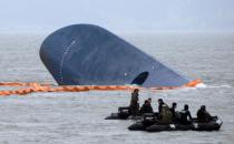 South Korean coast guard search for survivors near Sewol ferry that capsized on its way to Jeju island from Incheon, at sea some 20 km off the island of Byungpoong, on April 17, 2014