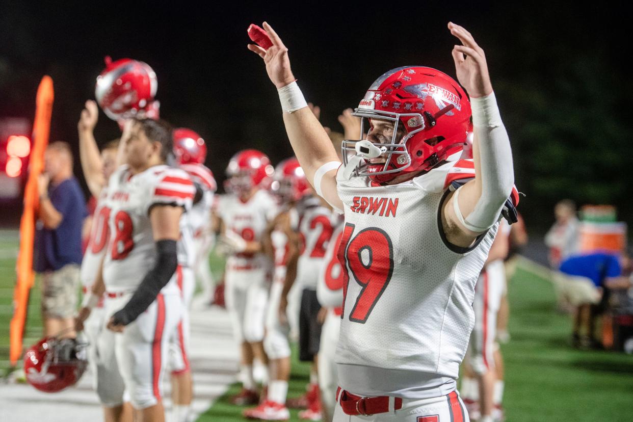 Erwin’s Rex Miller cheers for the Warriors in the game at Enka, September 15, 2023. Erwin won, 49-16.