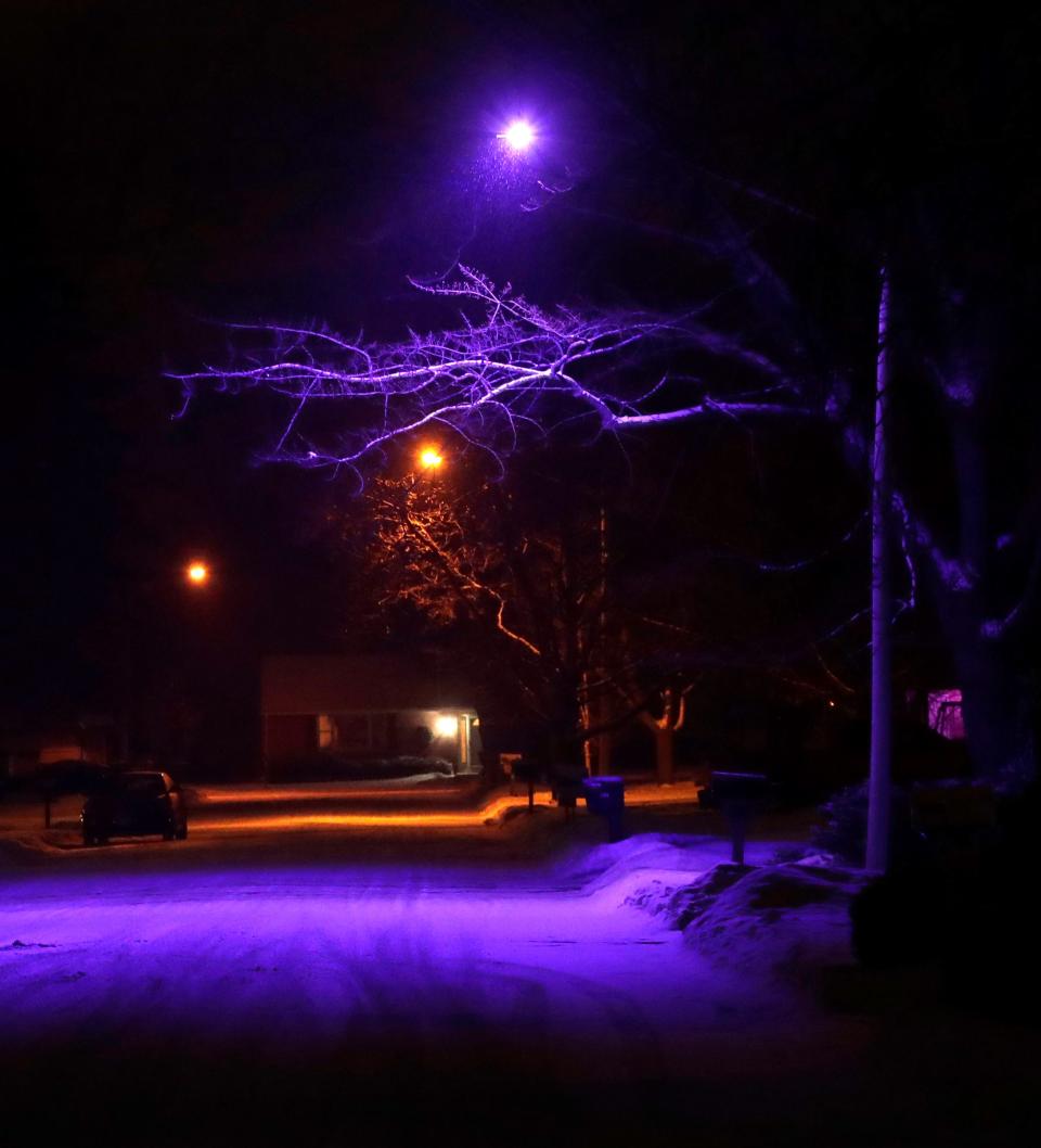 A purple-colored street light illuminates Fairview Avenue  in Allouez.