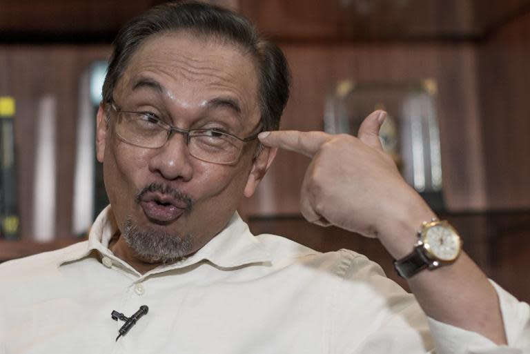 Malaysian opposition leader Anwar Ibrahim speaks during an interview with AFP at his office in Kuala Lumpur on September 30, 2014