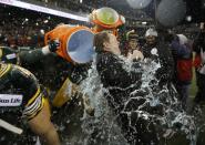 Edmonton Eskimos head coach Chris Jones is doused with water after the team's victory over the Ottawa Redblacks during the CFL's 103rd Grey Cup championship football game in Winnipeg, Manitoba, November 29, 2015. REUTERS/Mark Blinch