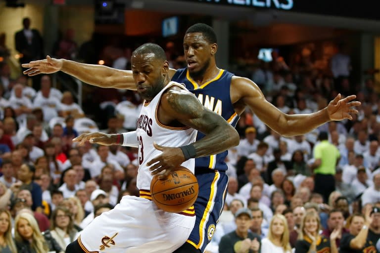 LeBron James of the Cleveland Cavaliers controls the ball in front of Thaddeus Young of the Indiana Pacers in Game Two of the Eastern Conference quarter-finals during the 2017 NBA Playoffs, at Quicken Loans Arena in Cleveland, Ohio, on April 17