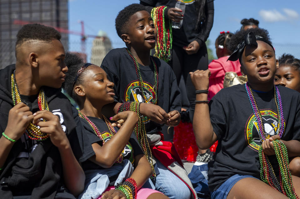 Members of Willie O'Ree Academy and Pittsburgh I.C.E. sit on the Penguin's float during the Juneteenth Voting Rights Parade lineup on Saturday, June 18, 2022, in Pittsburgh. Willie O'Ree Academy, an ice hockey training program for young Black players, and Pittsburgh I.C.E., Inclusion Creates Equality, were invited to ride on the Penguin's float in the parade from Freedom Corner to Point State Park. (Ariana Shchuka/Pittsburgh Post-Gazette via AP)