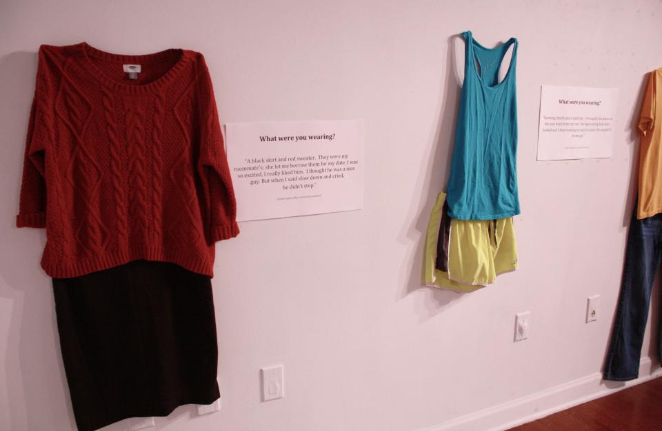 The art exhibit, "What Were You Wearing," shown here at the University of Kansas, was inspired by one of Mary Simmerling's poems about navigating the world after a sexual assault.