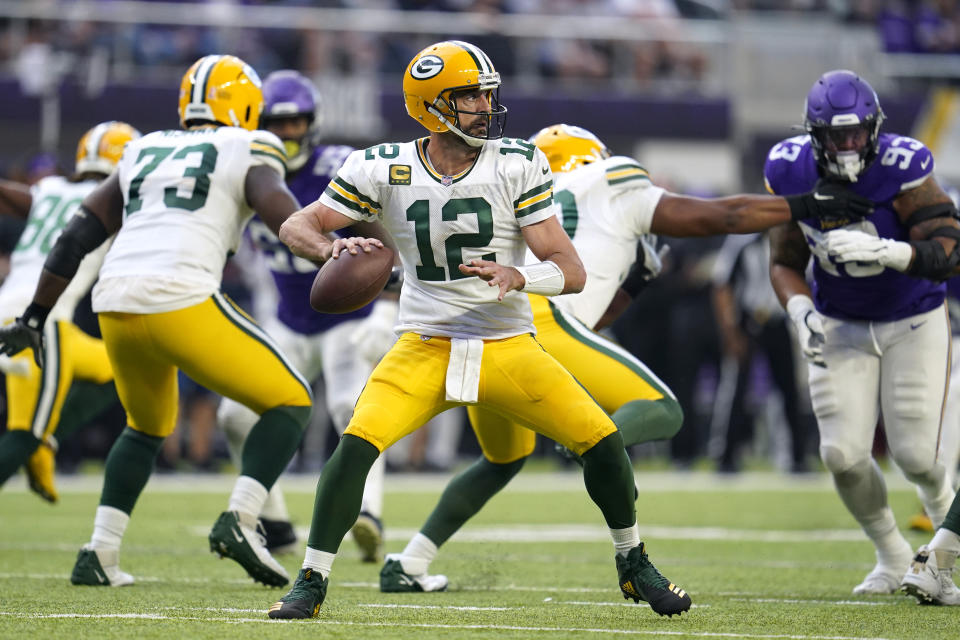 Green Bay Packers quarterback Aaron Rodgers (12) throws a pass during the second half of an NFL football game against the Minnesota Vikings, Sunday, Sept. 11, 2022, in Minneapolis. (AP Photo/Abbie Parr)