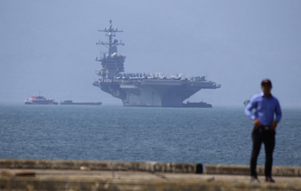 FILE - In this March 5, 2018, file photo, USS Carl Vinson is anchored at Tien Sa Port in Danang, Vietnam. Vietnam's selection as the venue for the second summit between President Donald Trump and North Korean leader Kim Jong Un is largely a matter of convenience and security, but not without bigger stakes. Host Vietnam hopes to boost its international profile as diplomatic leverage against its big northern neighbor China, whose historical pushiness is manifested nowadays in its territorial claims in the South China Sea over waters claimed by Hanoi. (AP Photo/Tran Van Minh, File)