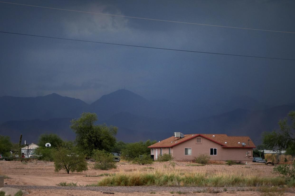 Severe weather crosses the sky near North Alma School and McDowell Roads as high winds, dust storms and rain stretch across Maricopa County on Friday, Aug. 12, 2022. 