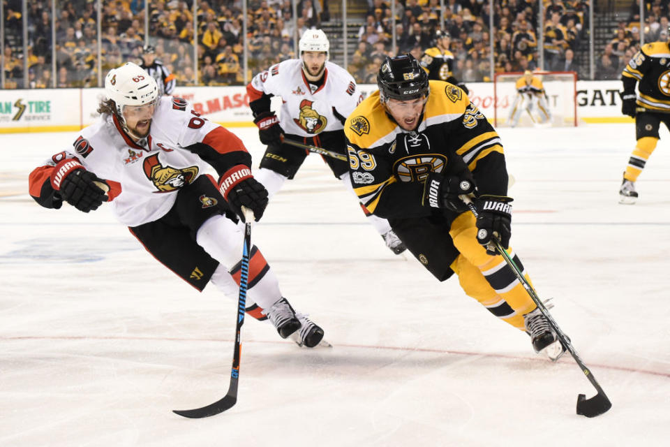 BOSTON, MA – APRIL 23: Tim Schaller #59 of the Boston Bruins skates with the puck against Erik Karlsson #65 of the Ottawa Senators in Game Six of the Eastern Conference First Round during the 2017 NHL Stanley Cup Playoffs at the TD Garden on April 23, 2017 in Boston, Massachusetts. (Photo by Brian Babineau/NHLI via Getty Images)