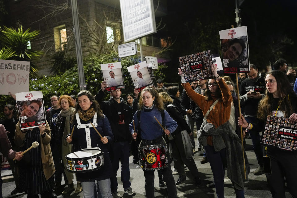 FILE- Relatives and supporters of the Israeli hostages held in the Gaza Strip by the Hamas militant group attend a protest calling for their release outside Israeli Prime Minister Benjamin Netanyahu's residence, in Jerusalem, Sunday, Jan. 21, 2024. After the Oct. 7 attack by Hamas, Israelis put aside their differences and rallied behind the war effort in Gaza. But as the war grinds on, the mood of the Israeli public is shifting and old divisions are reemerging. The catalyst is a rift over the polarizing leadership of Netanyahu and a growing frustration with his management of the war. (AP Photo/Ohad Zwigenberg, File)