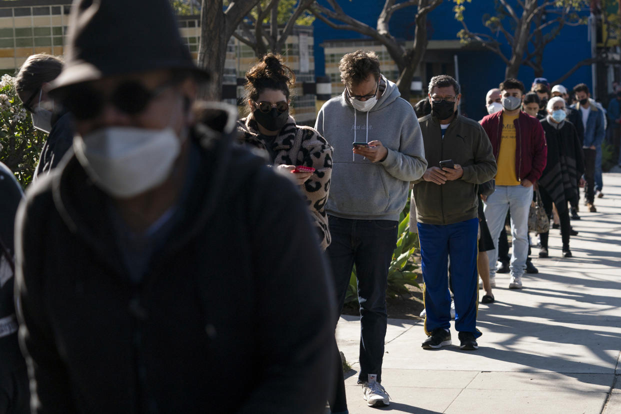 People wait in line for a COVID-19 test in Los Angeles. (AP)