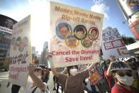 <p>People protest against the Opening ceremony of 2020 Tokyo Summer Olympic Games on July 23, 2020 in Tokyo, Japan, as they ask for the cancel of the Games a few hours ahead of the Opening ceremony of the Tokyo Games. (Photo by David MAREUIL/Anadolu Agency via Getty Images)</p> 