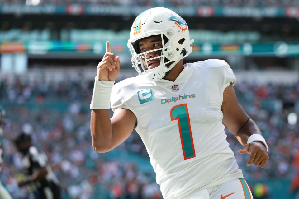 Miami Dolphins quarterback Tua Tagovailoa (1) celebrates his touchdown pass to tight end Durham Smythe (not pictured) during the first half Sunday, Nov. 27, 2022, against the Houston Texans at Hard Rock Stadium in Miami Gardens, Florida.