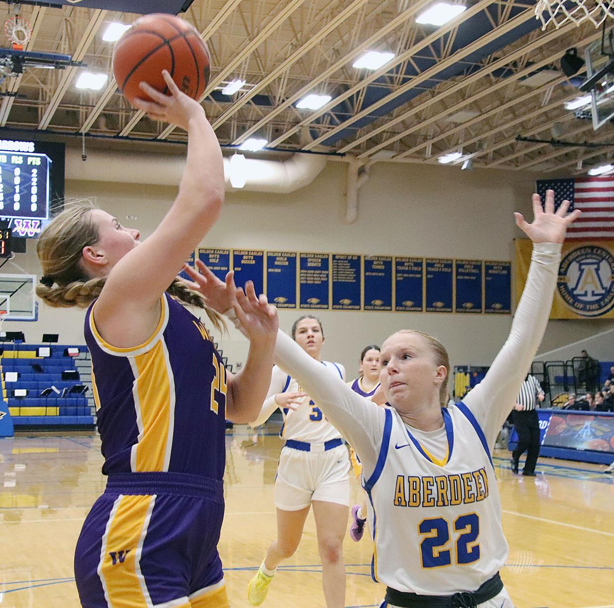 Watertown's Jade Lund shoots over Aberdeen Central's Ava Yeske during their high school girls basketball game on Tuesday, Feb. 13, 2024 at Aberdeen Central High School. Watertown won 55-46.