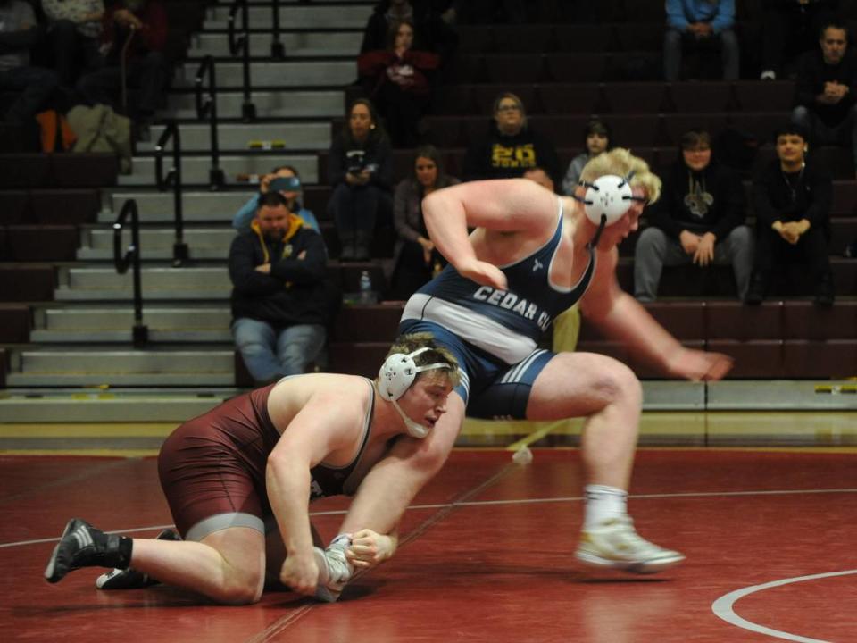 State College’s Nick Pavlechko finishes off an ankle pick of Cedar Cliff’s Guner Hiller in their 285-pound match of the Little Lions’ 34-32 win on Thursday at State College. Pavlechko pinned Hiller in 1:37.