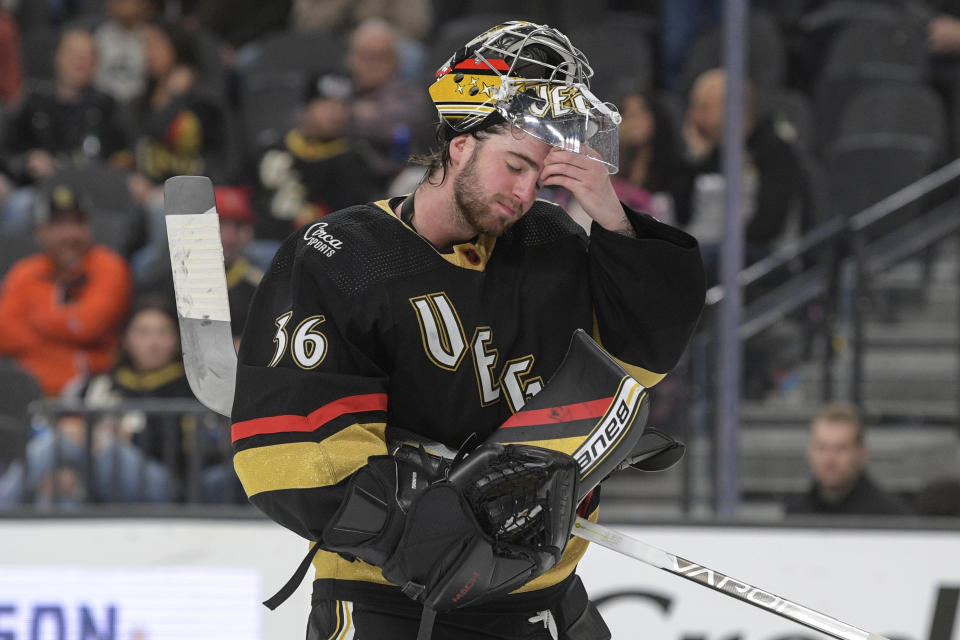 Vegas Golden Knights goaltender Logan Thompson (36) rubs his head after they gave up an open net goal to the New York Islanders during the third period of an NHL hockey game Saturday, Dec. 17, 2022, in Las Vegas. The Islanders defeated the Golden Knights 5-2. (AP Photo/Sam Morris)