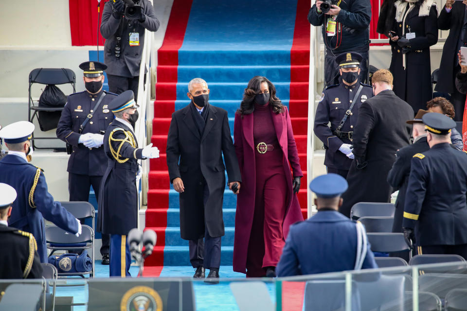 WASHINGTON, DC - JANUARY 20:  Former U.S. President Barack Obama and Michelle Obama at the inauguration of U.S. President-elect Joe Biden on the West Front of the U.S. Capitol on January 20, 2021 in Washington, DC.  During today's inauguration ceremony Joe Biden becomes the 46th president of the United States. (Photo by Rob Carr/Getty Images)