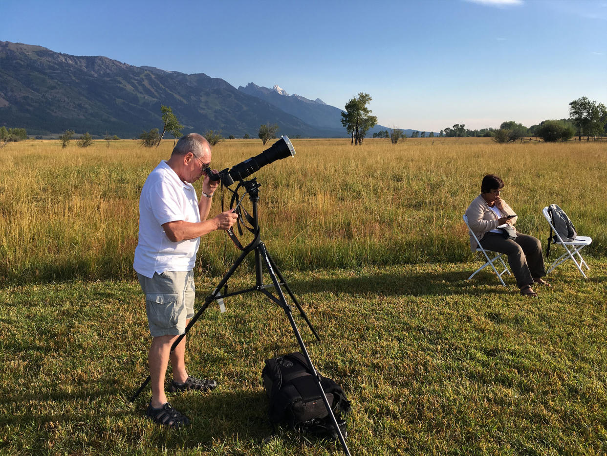 Tourists make the most of the clear skies to watch the solar eclipse near Jackson, Wyoming: Simon Calder