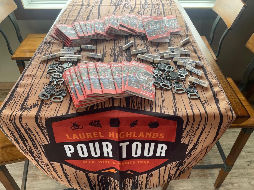 Pour Tour 4.0 passports and souvenirs were laid on a table at Forbes Trail Brewing in Stoystown.
