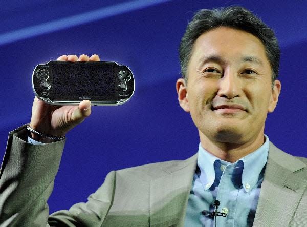 Kazuo Hirai with Playstation Vita