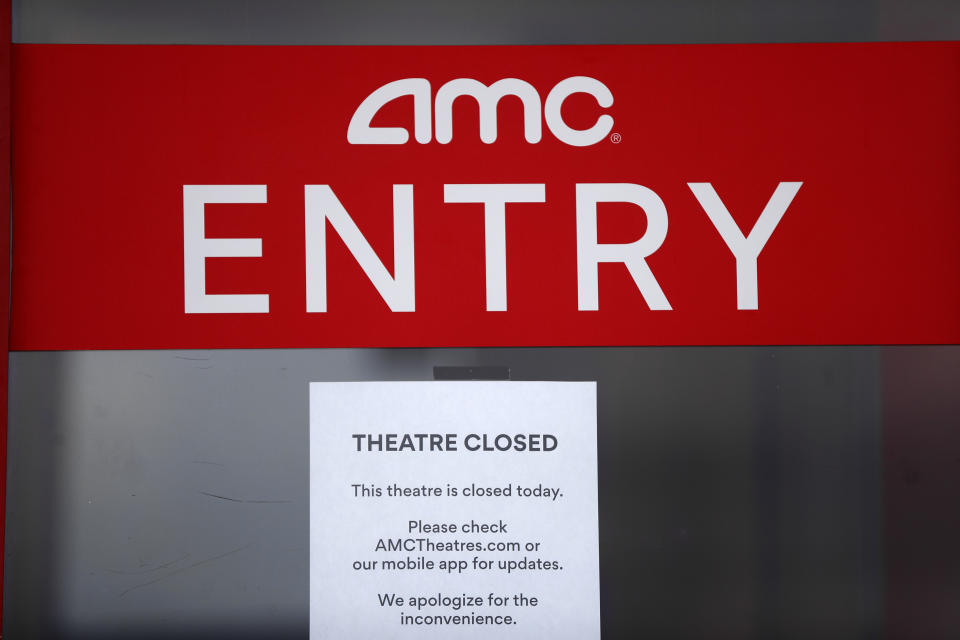 A closed sign is displayed on an AMC Theatre in Clinton Township, Mich., Friday, May 8, 2020. All AMC theatres are temporarily closed due to the coronavirus pandemic. (AP Photo/Paul Sancya)