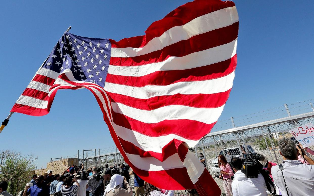 Protesters outside a tented migrant's shelter in Texas - AP