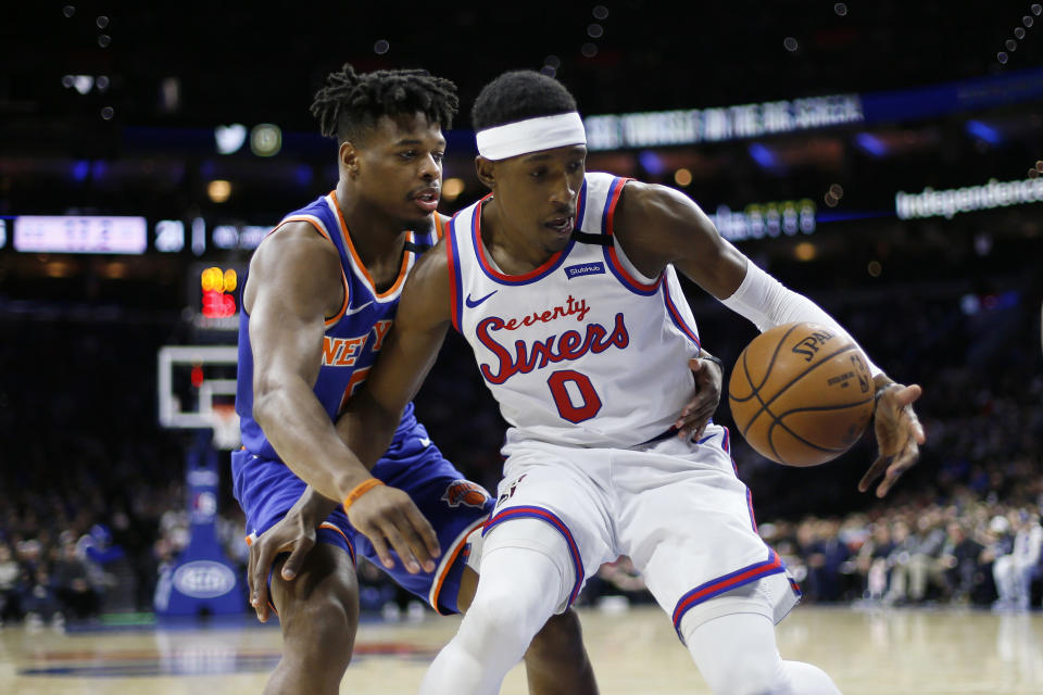 Philadelphia 76ers' Josh Richardson, right, steals the ball from New York Knicks' Dennis Smith Jr. during the first half of an NBA basketball game, Thursday, Feb. 27, 2020, in Philadelphia. (AP Photo/Matt Slocum)