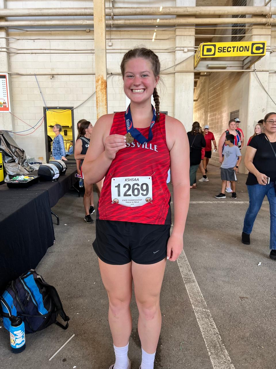 Rossville senior Briar Gillum poses with her medal after taking second in the discus throw.