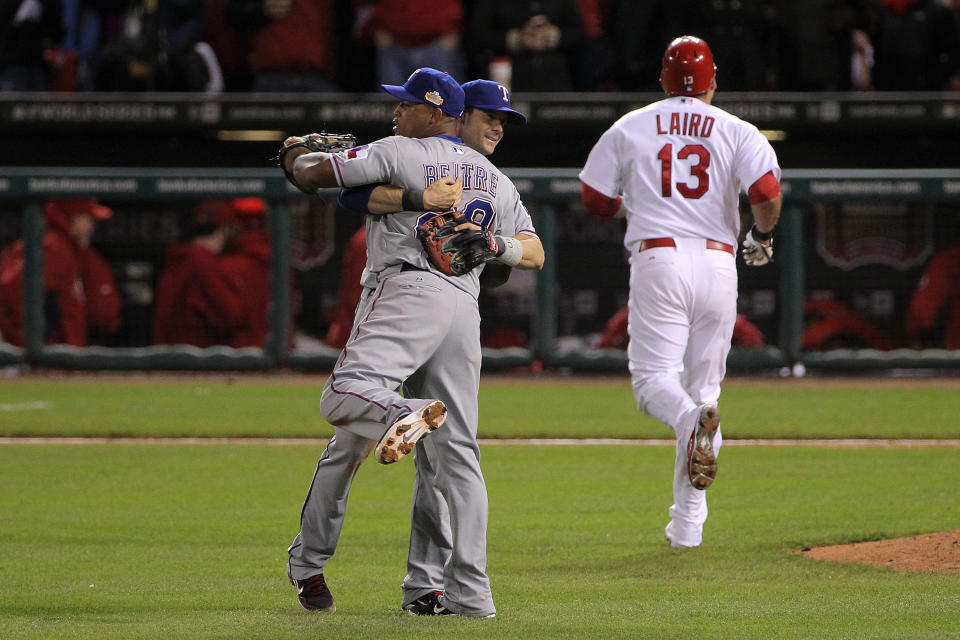 ST LOUIS, MO - OCTOBER 20: Michael Young #10 and Adrian Beltre #29 of the Texas Rangers celebrate after defeating the St. Louis Cardinals 2-1 in Game Two of the MLB World Series at Busch Stadium on October 20, 2011 in St Louis, Missouri. (Photo by Doug Pensinger/Getty Images)