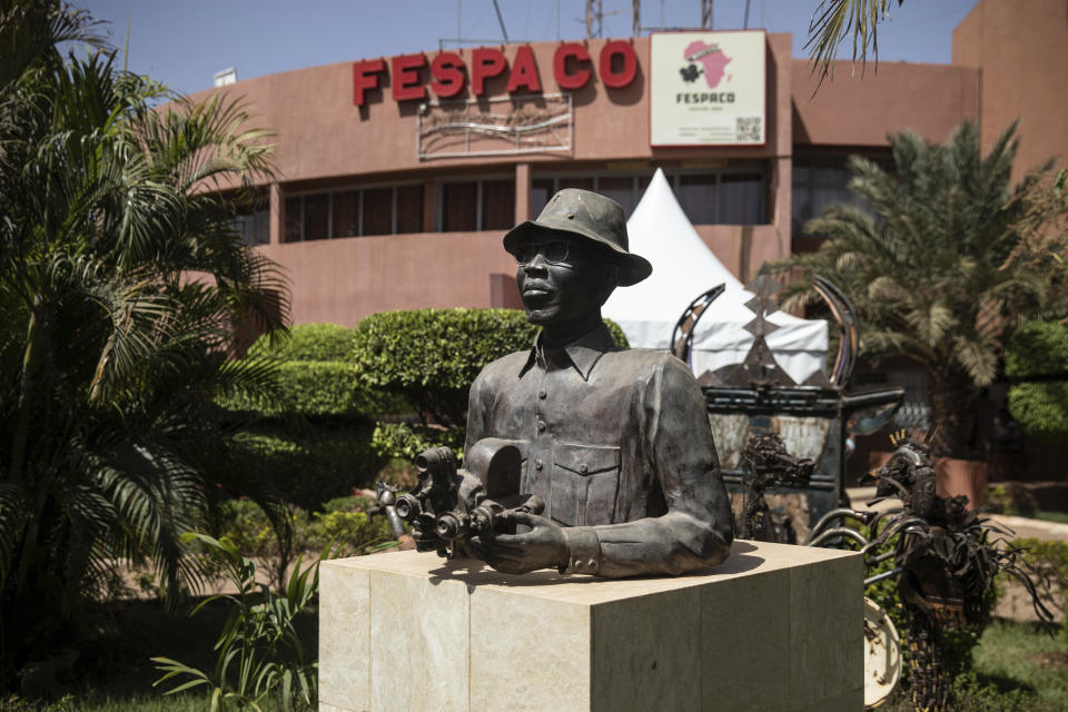 A statue of Paulin Soumanou Vieyra, considered one of the founding fathers of African cinema, is displayed at the headquarters of the FESPACO (Pan-African Film and Television Festival) in Ouagadougou, Burkina Faso, Friday, Feb. 24, 2023. Most film festivals can be counted on to provide entertainment, laced with some introspection. The weeklong FESPACO that opens Saturday in violence-torn Burkina Faso's capital goes beyond that to also offer hope, and a symbol of endurance. (AP Photo/Sophie Garcia)