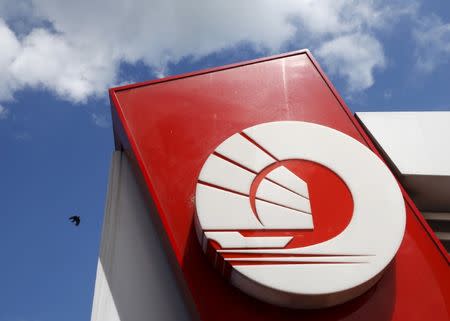 A logo of an Oversea-Chinese Banking Corporation (OCBC) bank is pictured outside an automated teller machine booth in Singapore in this January 5, 2016 file photo. REUTERS/Edgar Su/Files