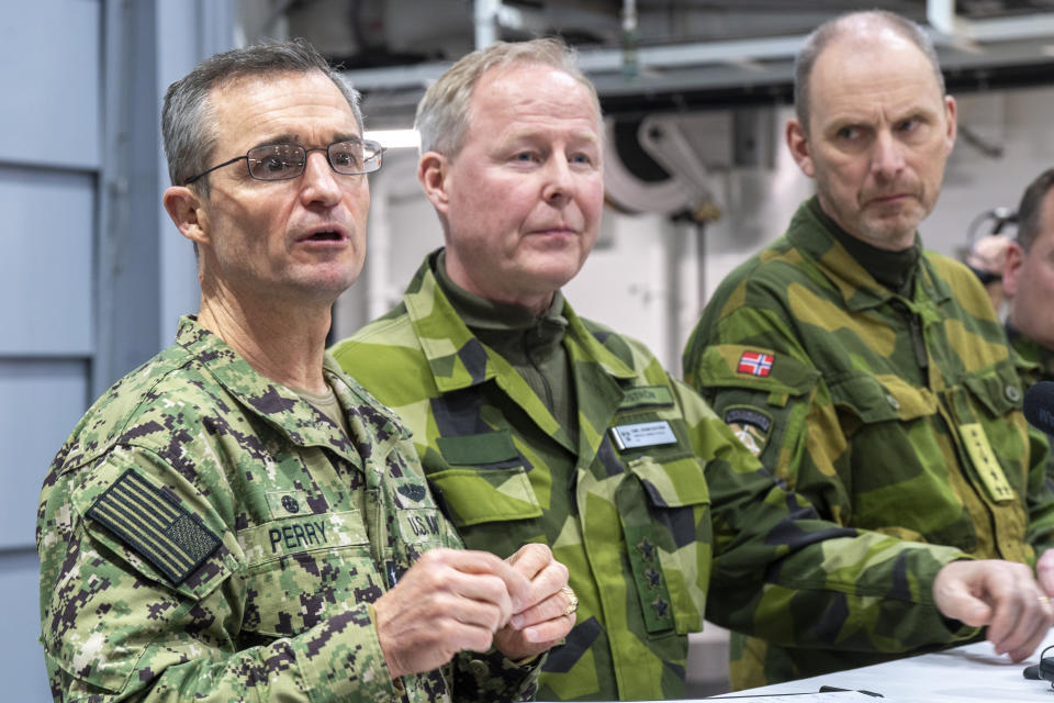 Admiral Douglas G. Perry, head of NATO's force command in Norfolk, lieutenant general Carl-Johan Edström, head of operations command in Sweden and head of operations, vice admiral Rune Andersen, meet for a so-called Commanders Huddle, aboard the Norwegian coast guard ship KV Bjørnøya off Alta, Norway, Friday, March 8, 2024, in connection with the military exercise Nordic Response. Over 20,000 Norwegian and allied soldiers from 13 countries will train together to defend the Nordic region. (Heiko Junge/NTB Scanpix via AP)