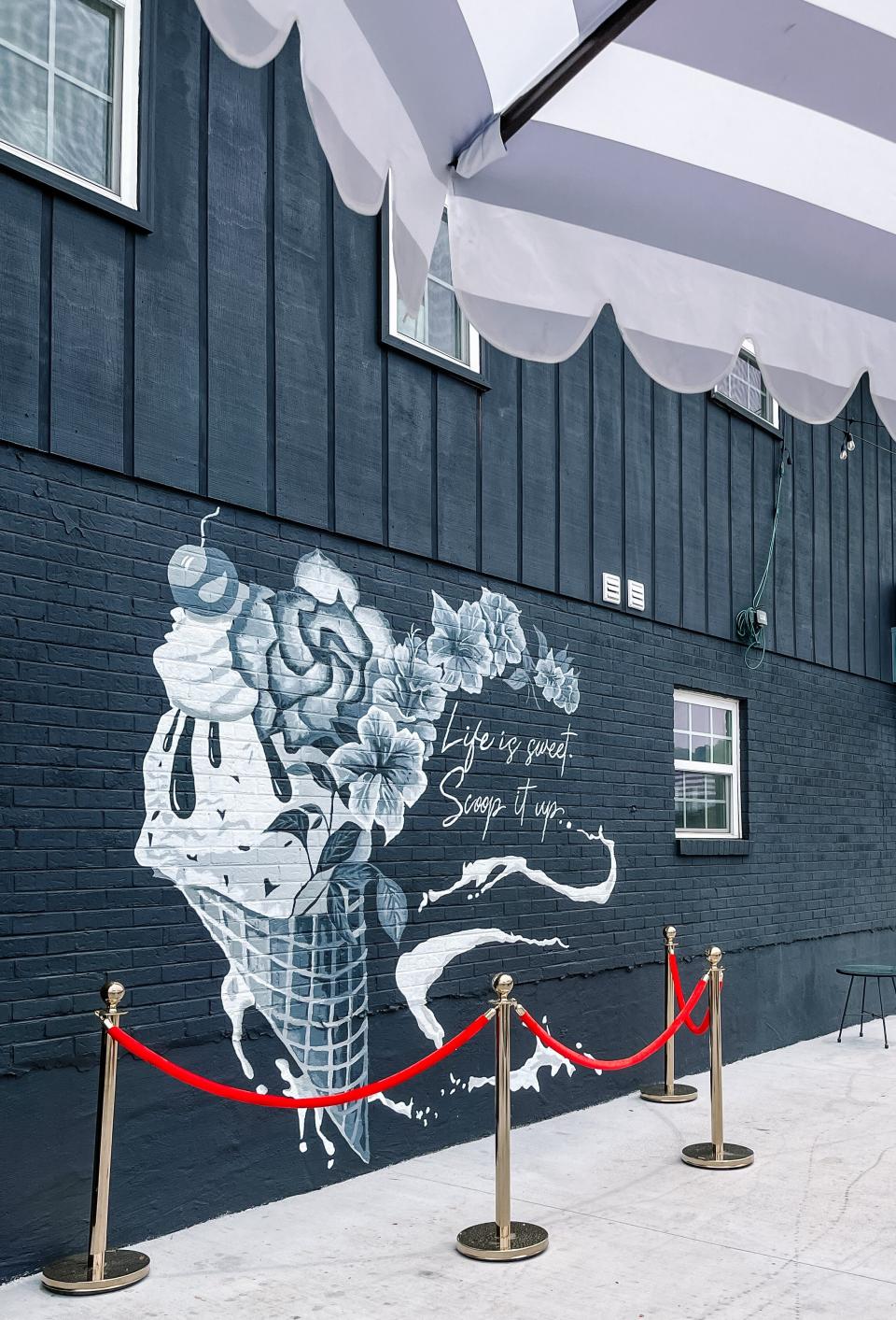 Muralist Mara Wilson painted this mural in front of customers as part of The Sugar Queen Creamery first birthday celebration. South Knoxville, June 29, 2023.