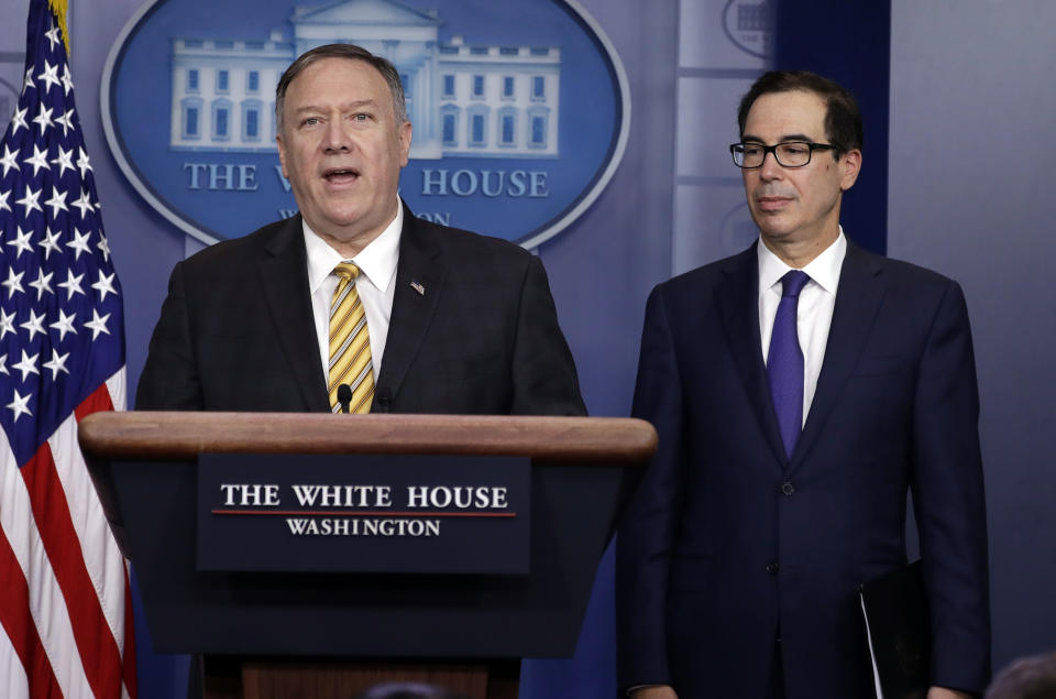 Secretary of State Mike Pompeo speaks as Treasury Secretary Steve Mnuchin listens during a briefing on terrorism financing at the White House, Tuesday, Sept. 10, 2019, in Washington. (AP Photo/Evan Vucci)