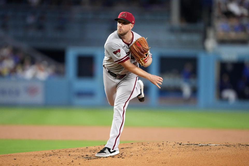 Aug 29, 2023; Los Angeles, California, USA; Arizona Diamondbacks starting pitcher Merrill Kelly (29) pitches in the first inning against the Los Angeles Dodgers at Dodger Stadium. Mandatory Credit: Kirby Lee-USA TODAY Sports