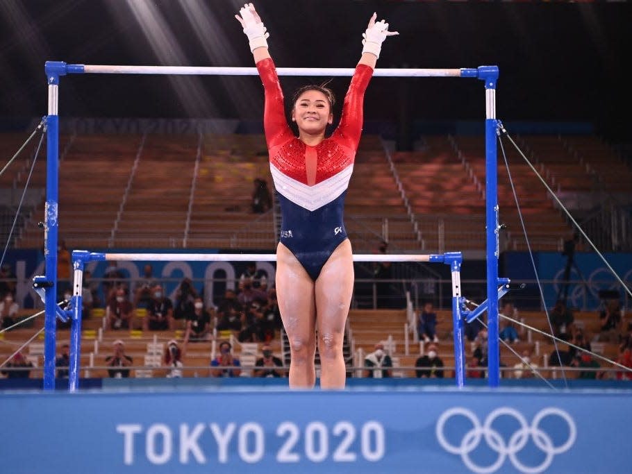 Suni Lee competes on uneven bars