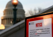 A sign announces the closure of the Library of Congress after President Donald Trump and the U.S. Congress failed to reach a deal on funding for federal agencies in Washington, U.S., January 20, 2018. REUTERS/Joshua Roberts