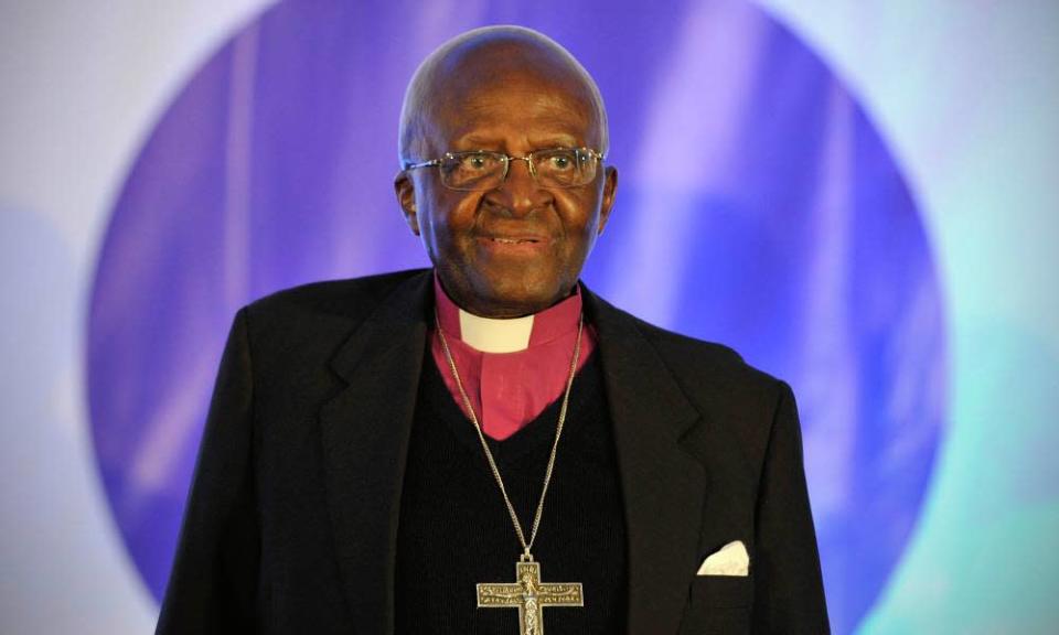 A picture of Archbishop Desmond Tutu standing before a crowd at the 5th Annual International Desmond Tutu Peace Lecture in 2015