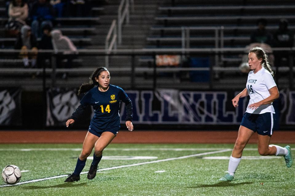 Lourdes' Julia Gigliotti, left, goes after the ball during the MHAL soccer championship game at Wallkill High School on Thursday, October 20, 2022.