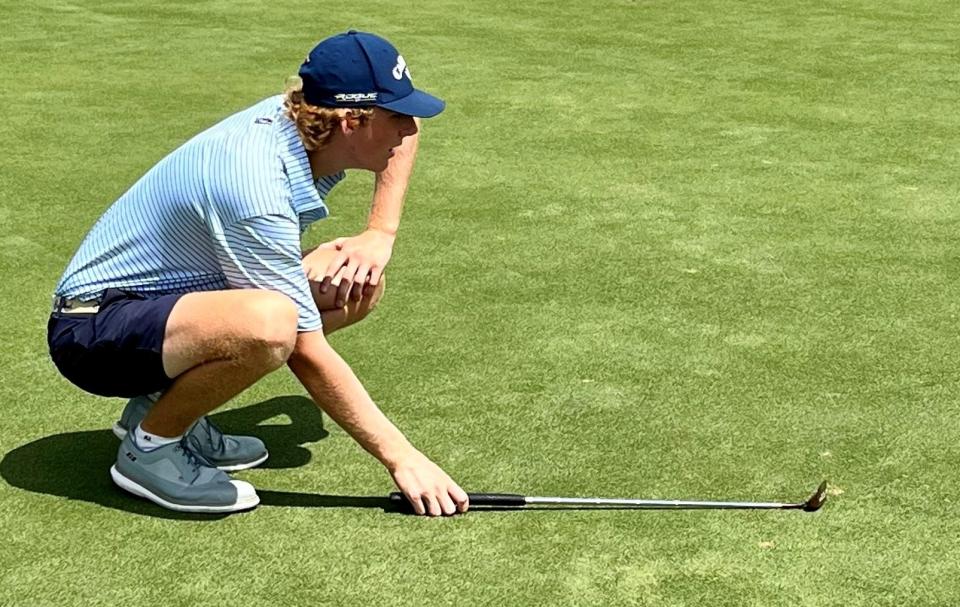 Andrew Riley lines up his birdie putt attempt at No. 9 of the Deerwood Country Club on Saturday during the final round of the Jacksonville Amateur.