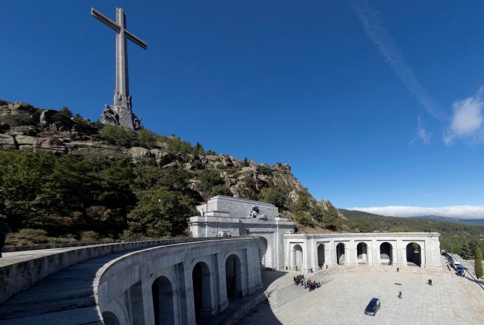 Relatives carry the coffin with the remains of Spanish dictator General Francisco Franco at the Valley of the Fallen mausoleum near El Escorial, outskirts of Madrid, Spain, Thursday, Oct. 24, 2019. Spain has exhumed the remains of Spanish dictator Gen. Francisco Franco from his grandiose mausoleum outside Madrid so he can be reburied in a small family crypt north of the capital. (AP Photo/Emilio Naranjo, Pool)