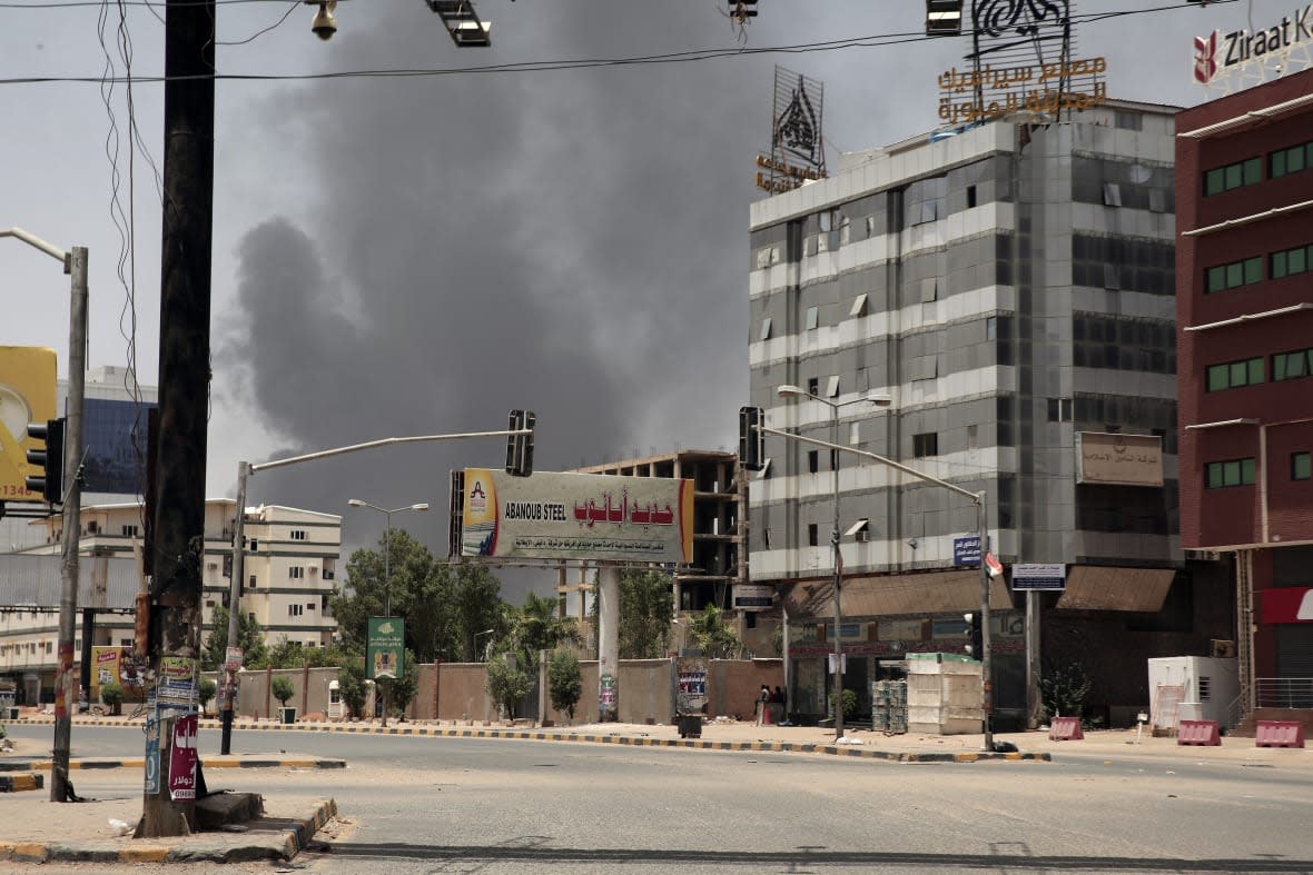 Smoke is seen rising from a neighborhood in Khartoum, Sudan, Saturday, April 15, 2023. (AP Photo/Marwan Ali)