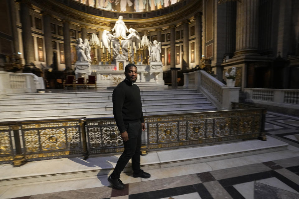 Jason Nioka, a former judo champion and deacon who's in charge of the largest contingent of Olympic chaplains, about 40 priests, nuns and lay Catholics, walks inside the Madeleine church, Thursday, May 30, 2024 in Paris. As athletes rev up their training and organizers finalize everything from ceremonies to podiums before the Paris Olympics, more than 120 faith leaders are preparing for a different challenge – spiritually supporting some 14,000 participants from around the world, especially those whose medal dreams will inevitably get crushed. (AP Photo/Michel Euler)