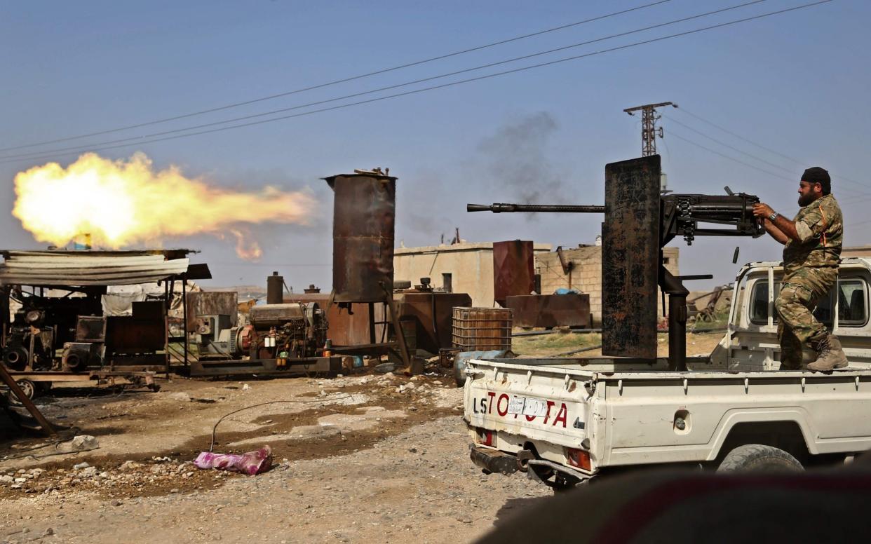 Fighting in the Turkish-Syrian border town of Ras al-Ain - AFP